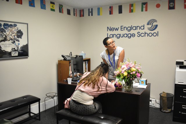 New England Language School Director Helping A Student