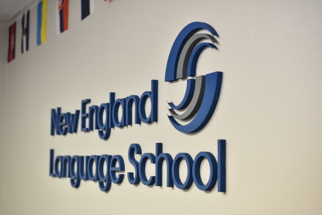 New England Language School Logo On Wall